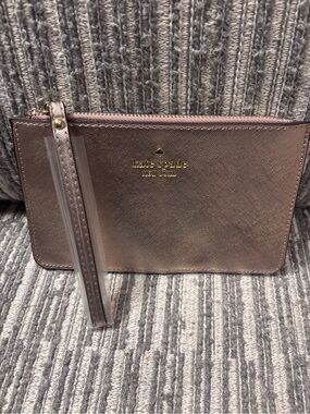 Kate Spade metallic rose gold wristlet strap pouch